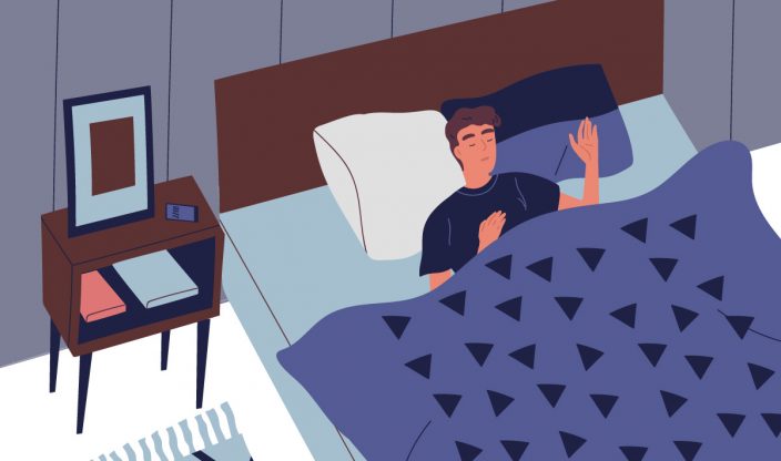 Mann schläft im Bett